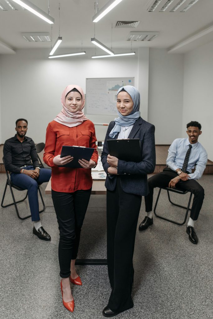 A multicultural office team engaged in a collaborative meeting in a modern setting.